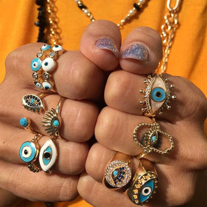 blue and white Evil Eye gold rings