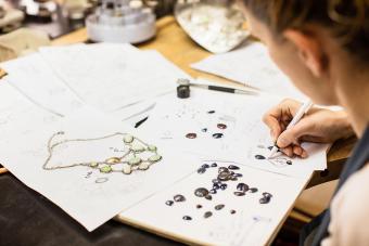 Woman designing jewelry in workshop