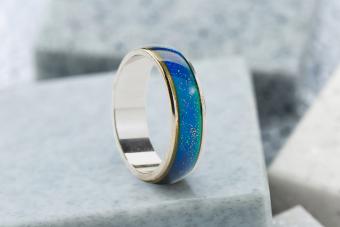 Mood ring on gray stone background