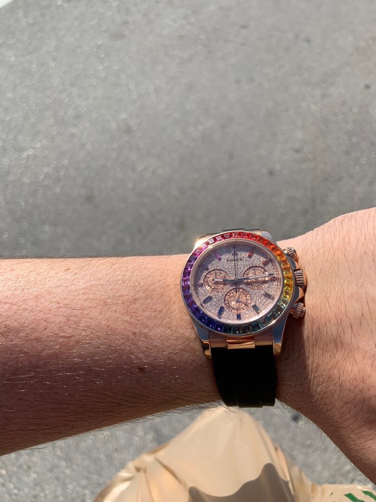 rainbow daytona rolex watch worn on wrist