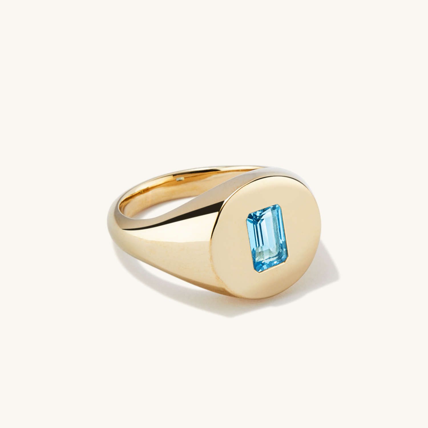 gold signet ring with blue topaz from Mejuri
